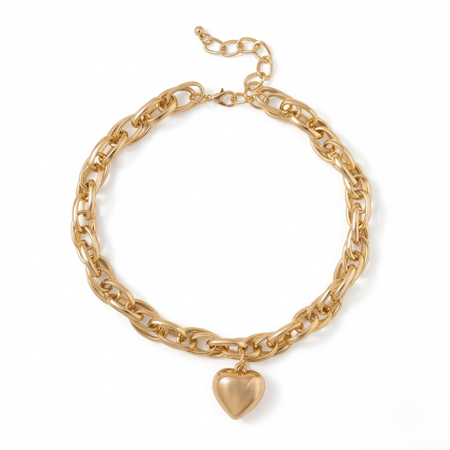 Gold chain bracelet with a heart-shaped charm on a white background