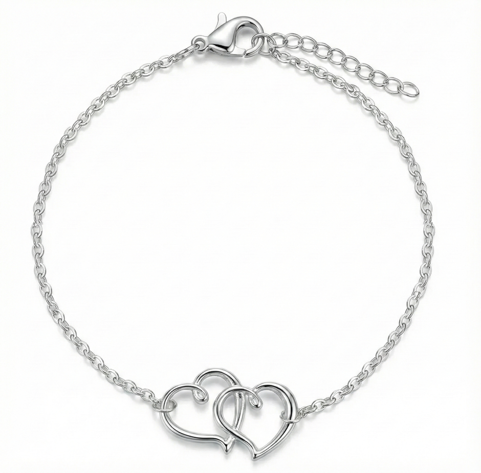 Silver bracelet with interlocking heart designs on a white background
