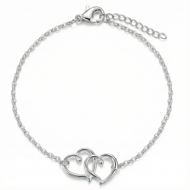 Silver bracelet with interlocking heart designs on a white background
