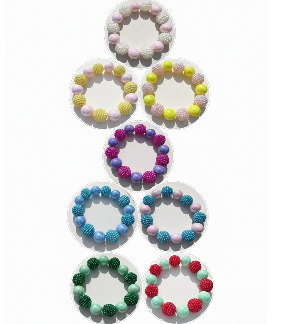 Set of colorful bracelets with bead designs on a white background