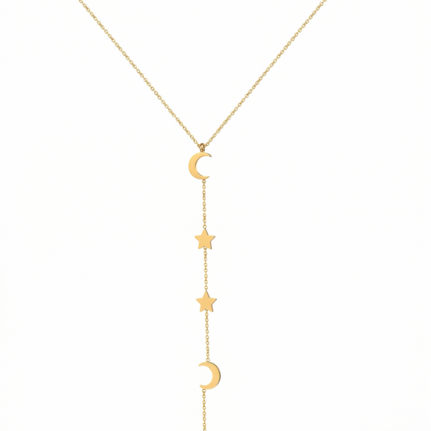 Gold necklace with star and moon pendants on a white background
