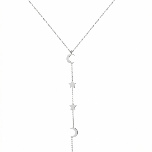 Silver necklace with star and moon pendants on a white background