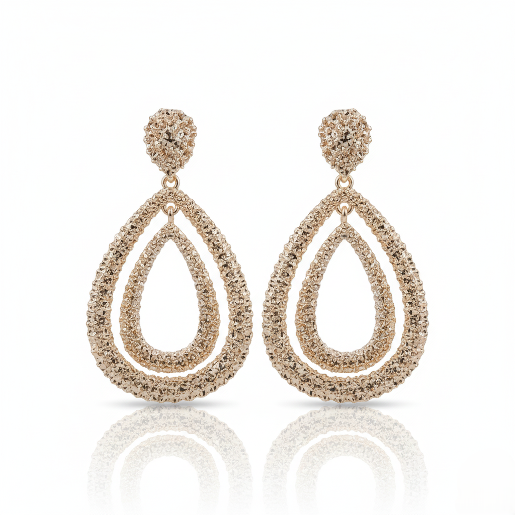 Pair of Gold-plated, double teardrop dangle earrings with a textured, rhinestone-encrusted finish. on a white background