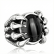 Silver ring with black gemstone on a white background
