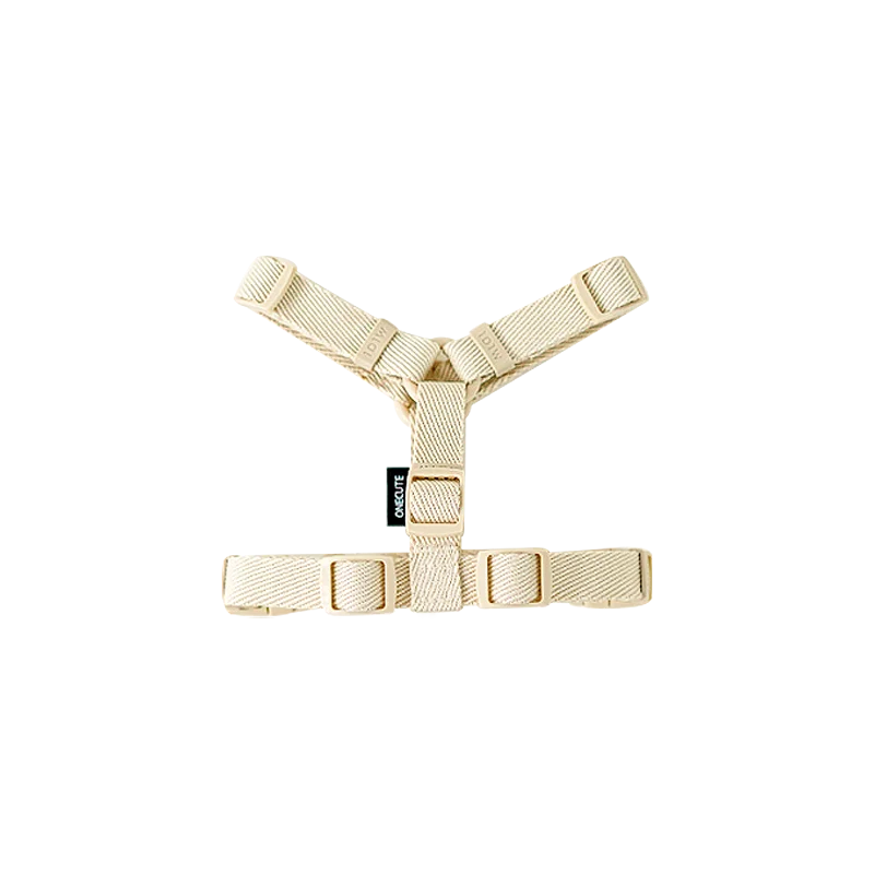 Beige dog harness on a white background