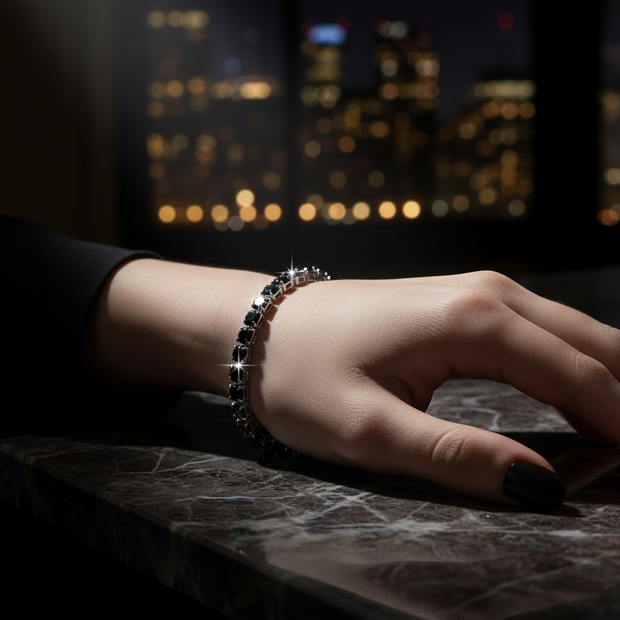 Hand wearing a bracelet with a cityscape in the background