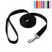 Black dog leash with a metal clip on a white background