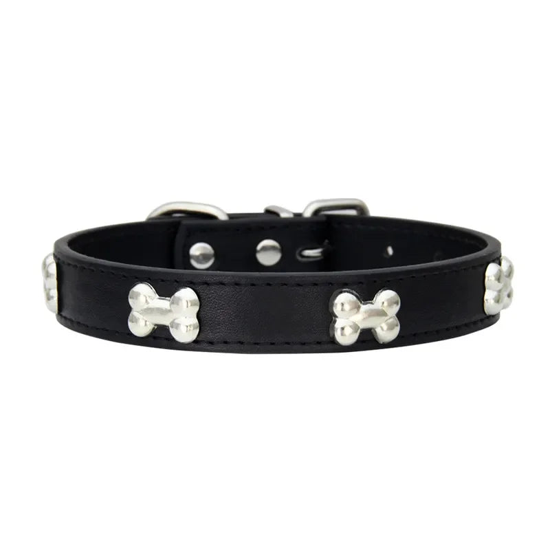 Black leather dog collar with silver bone-shaped studs on a white background