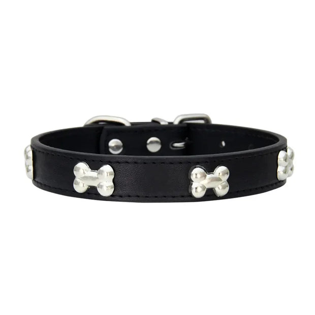 Black leather dog collar with silver bone-shaped studs on a white background