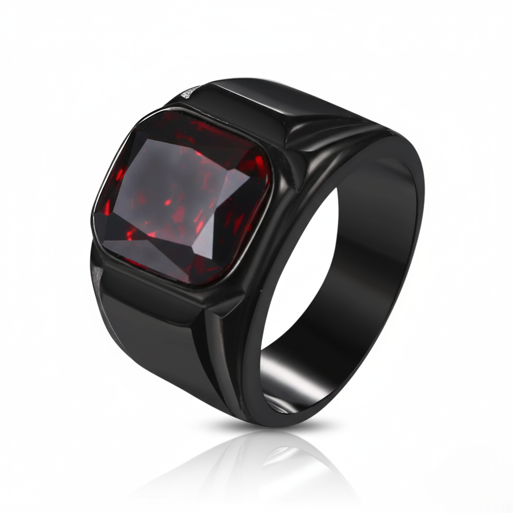 Black ring with a red gemstone on a white background