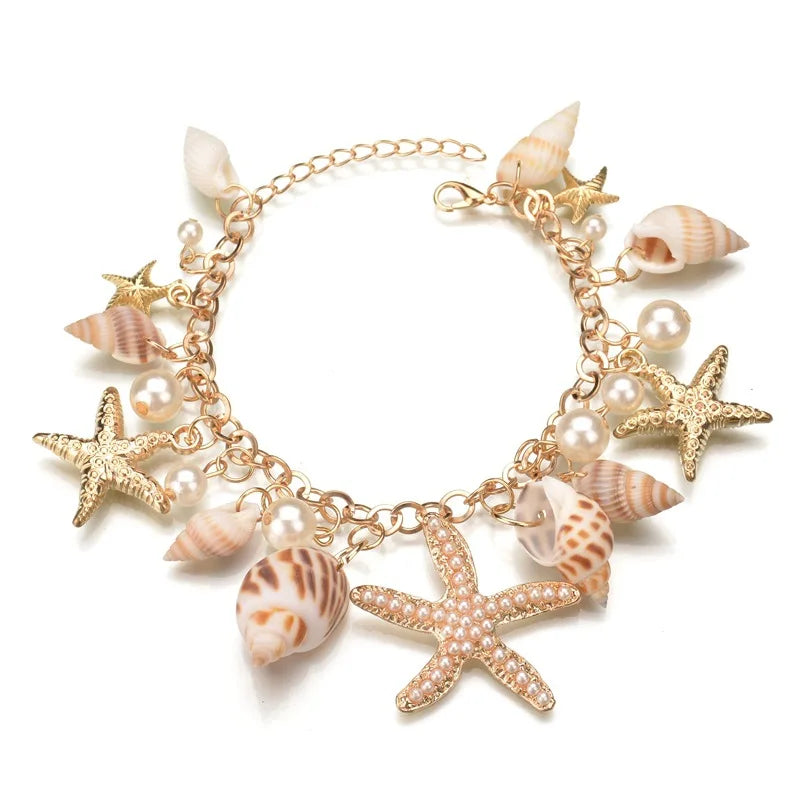 Bracelet with starfish and shell charms on a white background