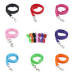 Collection of colorful dog leashes with matching connectors on a white background