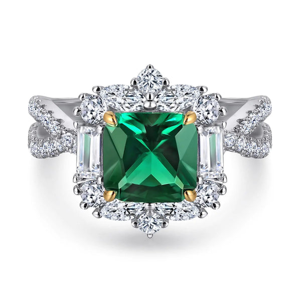 Elegant ring with a green gemstone and diamond accents on a white background