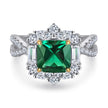 Elegant ring with a green gemstone and diamond accents on a white background