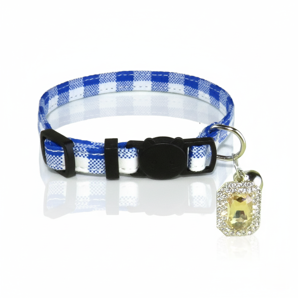 Dog collar with blue and white checkered pattern and decorative charm on a white background
