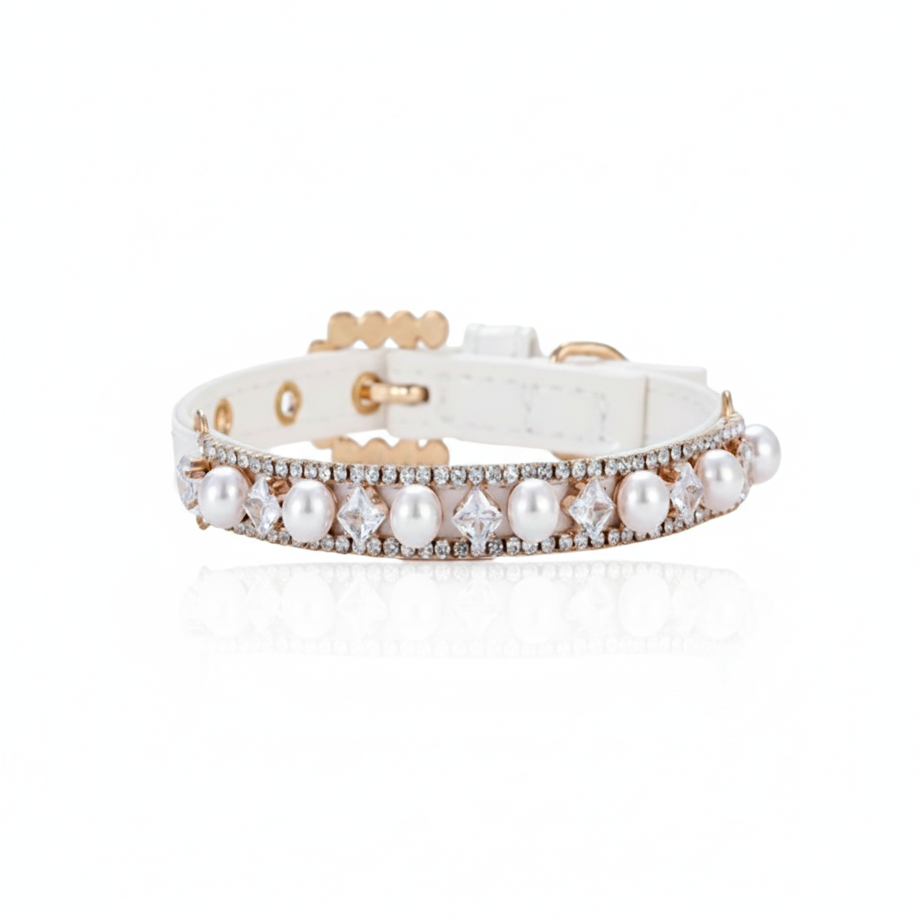 Dog collar with pearls and gold accents on a white background