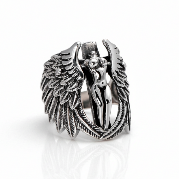 Silver ring with angel design on a white background