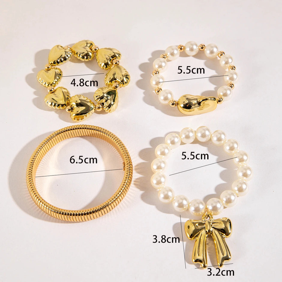 Gold and pearl bracelets with measurements on a white background