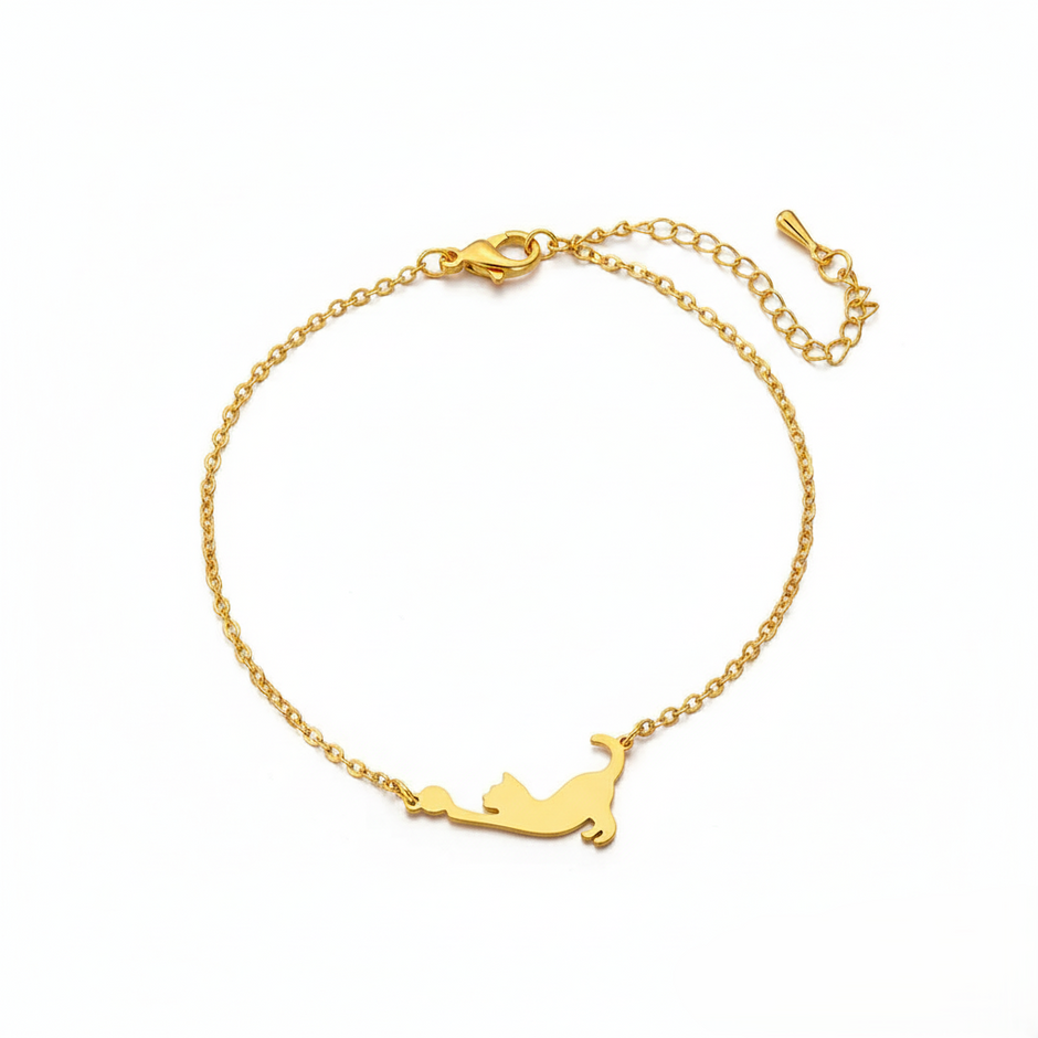 Gold bracelet with a cat-shaped pendant on a white background