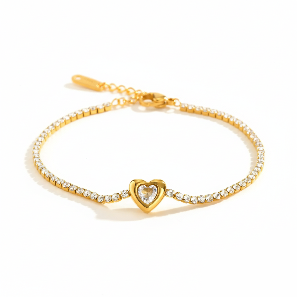 Gold bracelet with a heart-shaped clasp on a white background