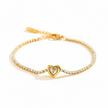 Gold bracelet with a heart-shaped clasp on a white background
