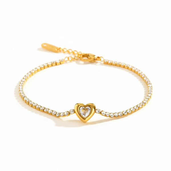 Gold bracelet with a heart-shaped clasp on a white background