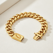 Gold chain bracelet on a light background