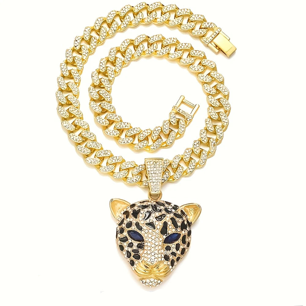Gold chain necklace with a leopard head pendant on a white background