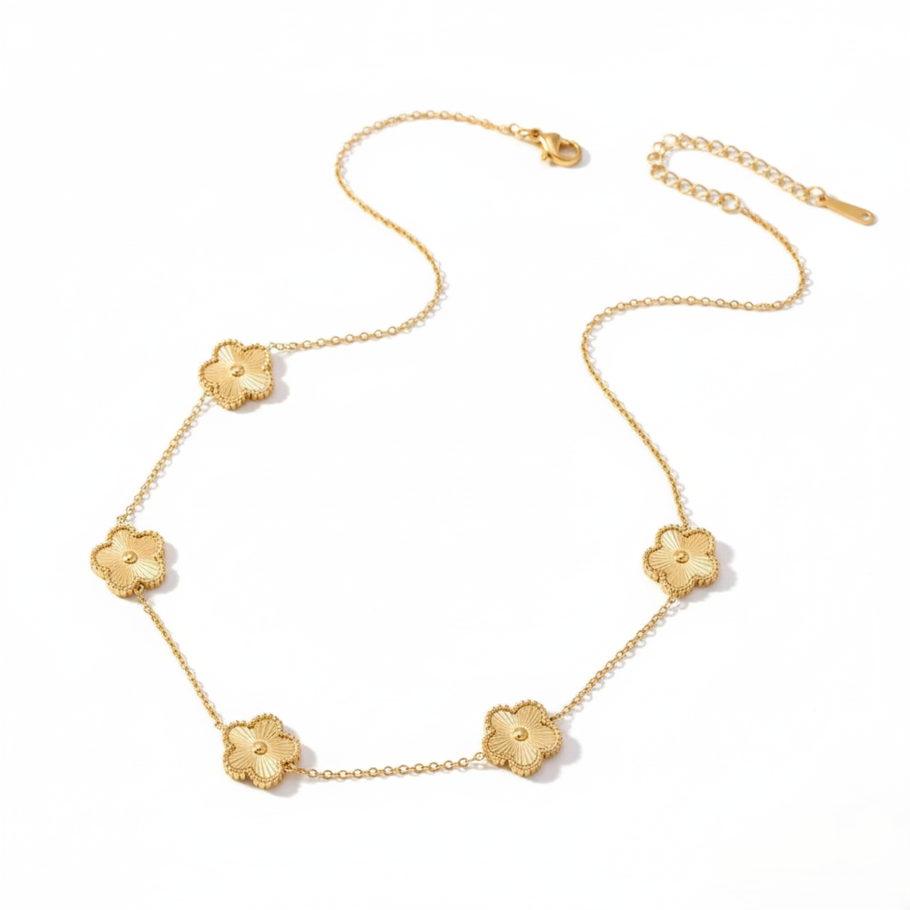 Gold necklace with floral pendants on a white background