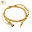 Gold snake-shaped bracelet on a white background