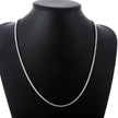 Silver necklace on a black mannequin bust