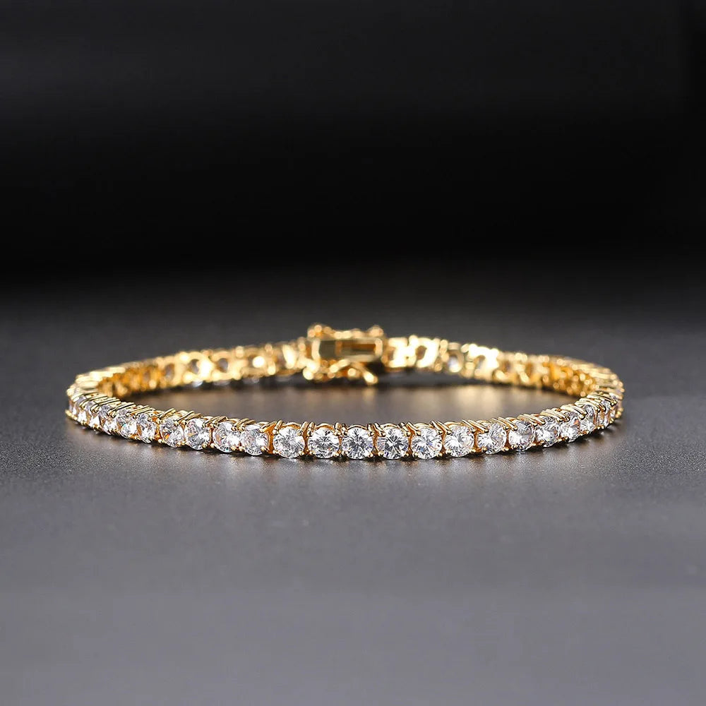 Gold bracelet with clear stones on a dark background