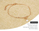 Rose gold anklet on a textured beige surface with maintenance instructions.