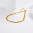 Gold chain anklet on a white background