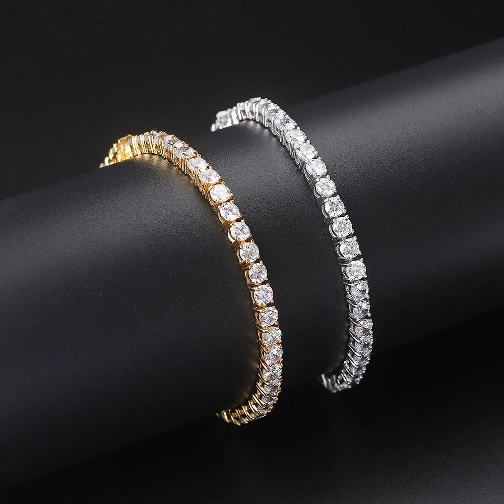 Two diamond bracelets, one gold and one silver, on a black background