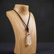 A hexagonal clear quartz crystal pendant on an adjustable braided rope - minimalist healing energy for the modern man.