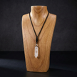 A hexagonal clear quartz crystal pendant on an adjustable braided rope - minimalist healing energy for the modern man.