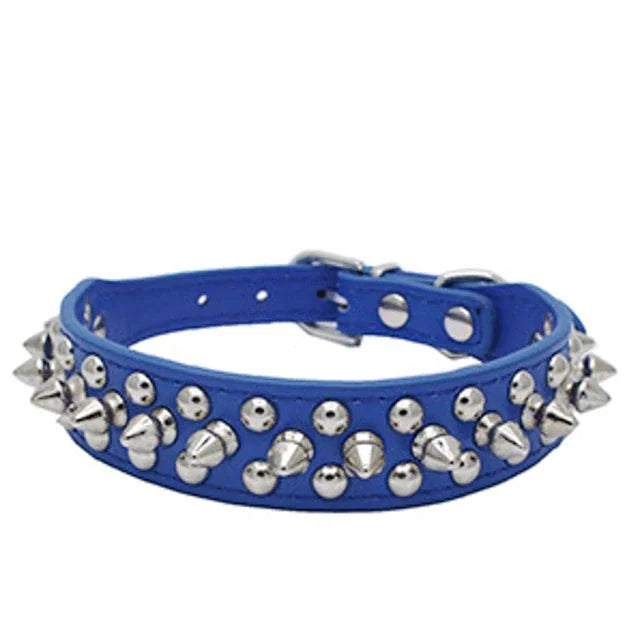 Blue dog collar with silver spikes on a white background