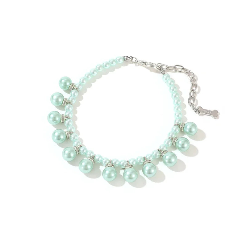 Mint green pearl collar on a white background