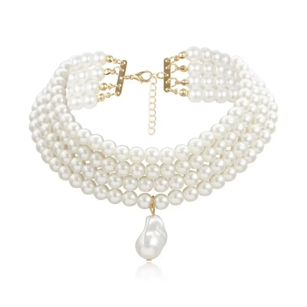 a choker-style necklace made of four rows of small, round white pearls. It has a gold-toned clasp at the back and a single, larger, teardrop-shaped white pearl pendant hanging from the center front.