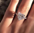 Simulated  Diamond ring on a finger with a blurred background