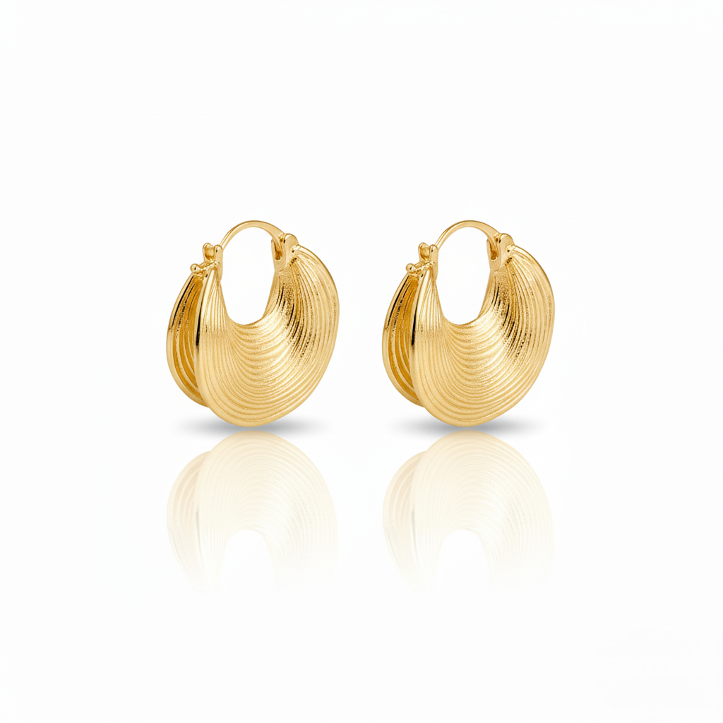 Pair of gold hoop earrings on a white background