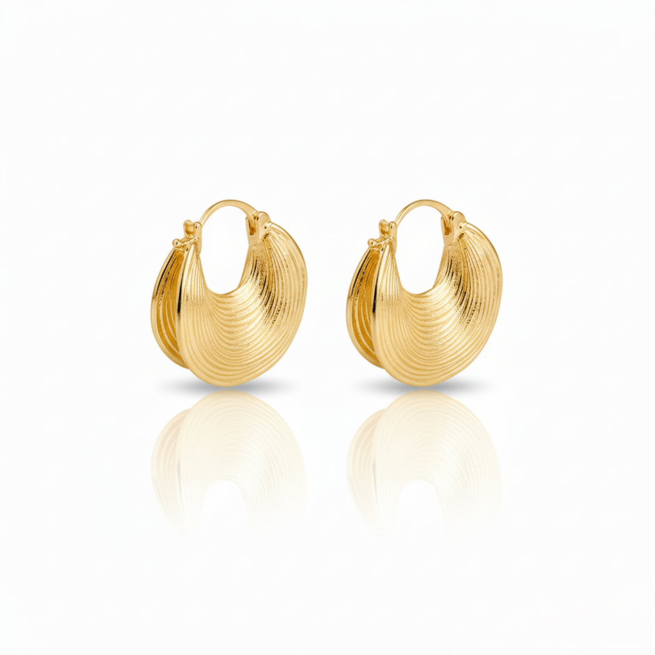 Pair of gold hoop earrings on a white background