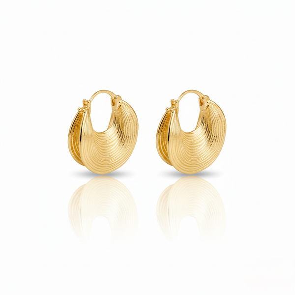 Pair of gold hoop earrings on a white background