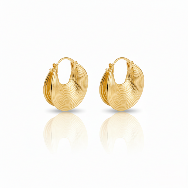 Pair of gold hoop earrings on a white background