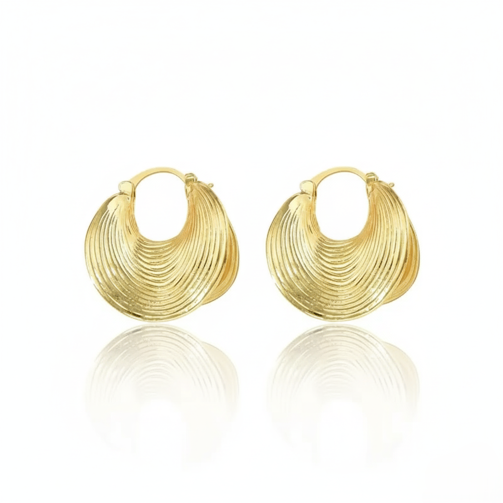 chunky gold hoop earrings.  on a white background