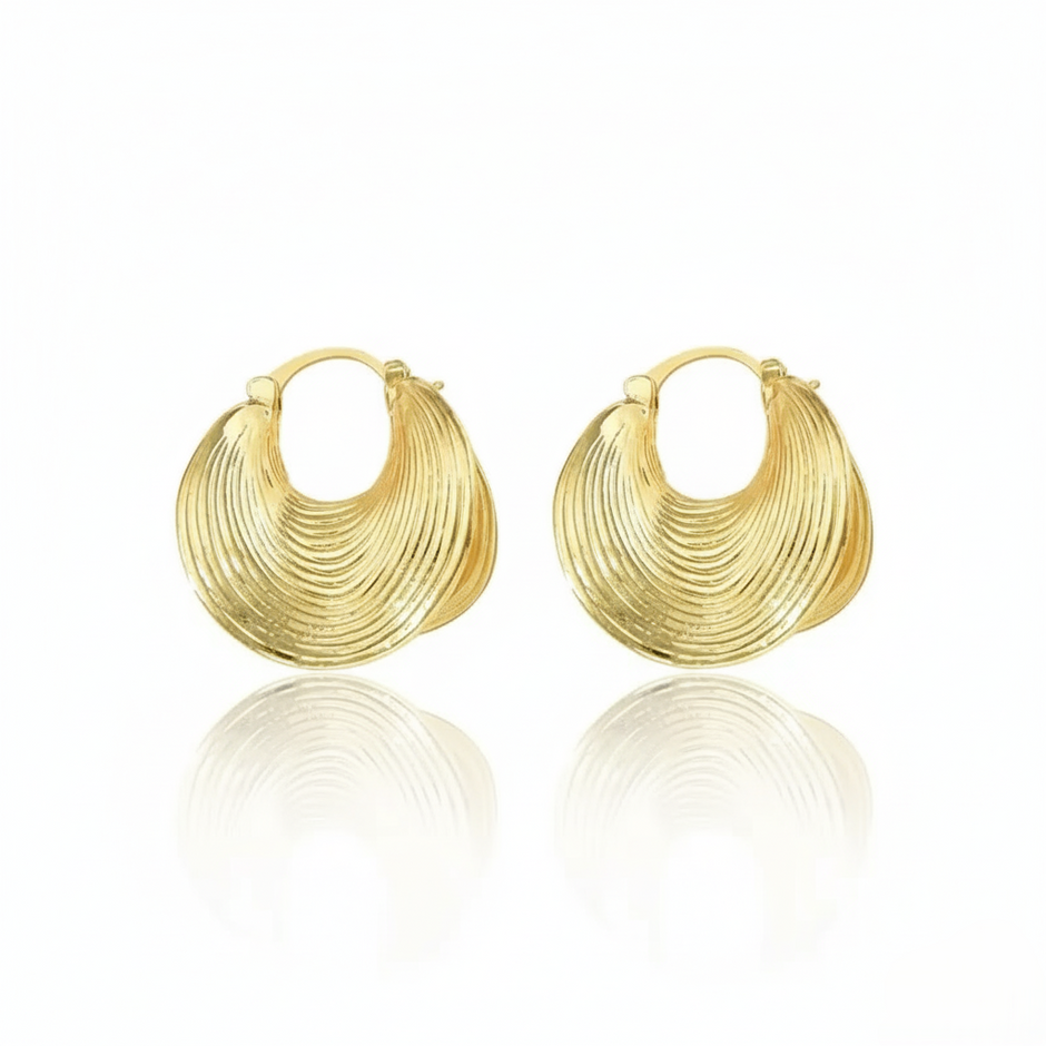 chunky gold hoop earrings.  on a white background