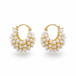 Pair of gold hoop earrings with pearl-like beads on a white background