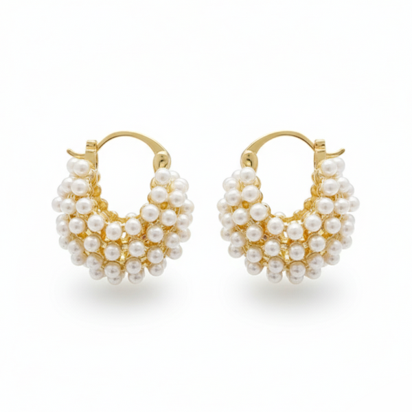 Pair of gold hoop earrings with pearl-like beads on a white background