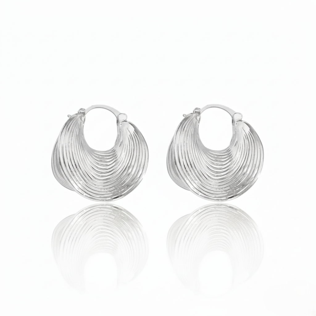 Pair of silver hoop earrings on a white background